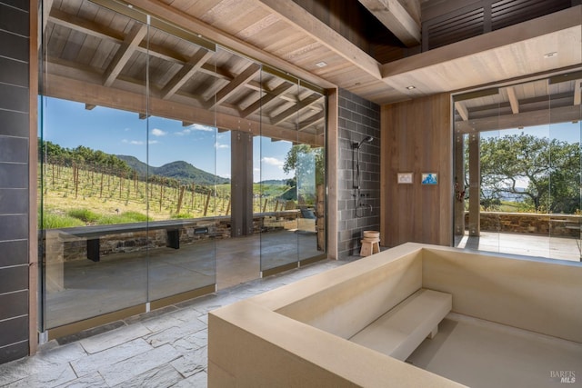 unfurnished sunroom with a mountain view