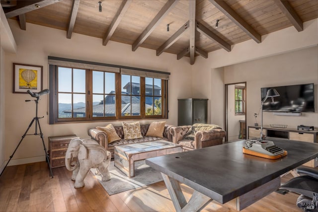 living room featuring wood ceiling, lofted ceiling with beams, baseboards, and wood-type flooring