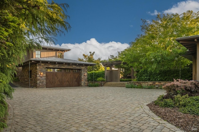 view of gate featuring a garage