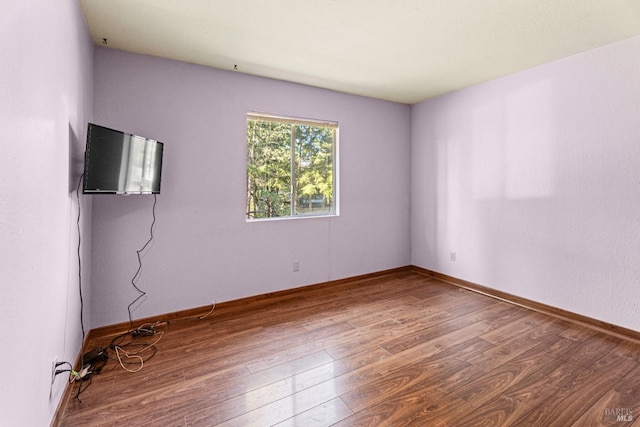 unfurnished room featuring hardwood / wood-style floors