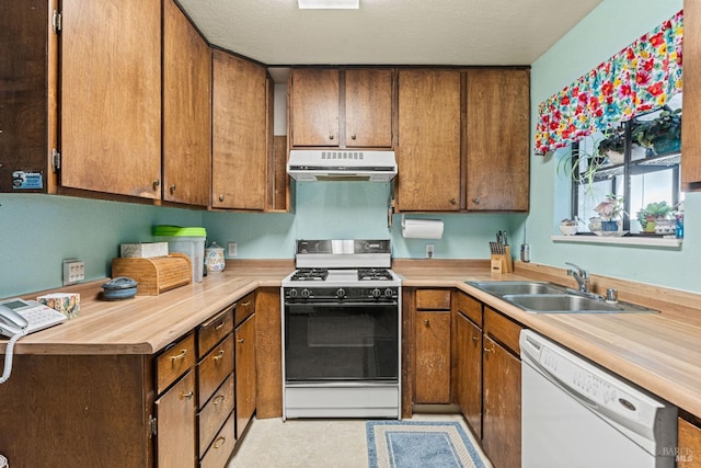 kitchen with sink, butcher block countertops, white dishwasher, range with gas stovetop, and a textured ceiling