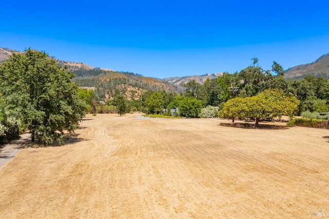 exterior space featuring a rural view and a mountain view