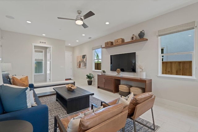 living room with baseboards, visible vents, ceiling fan, and recessed lighting