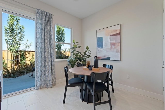 dining space featuring baseboards