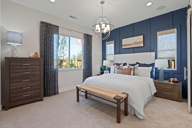 bedroom with light colored carpet, visible vents, an inviting chandelier, and recessed lighting