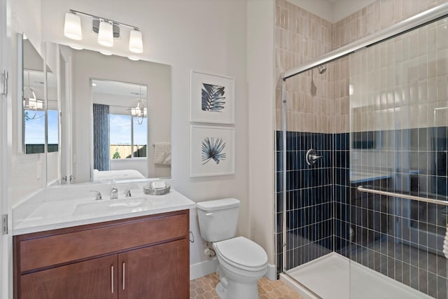 full bath with connected bathroom, a shower stall, toilet, and vanity