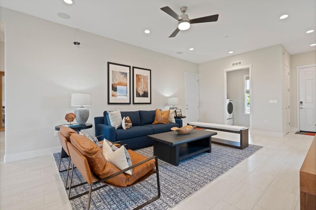 living room with ceiling fan, recessed lighting, visible vents, baseboards, and washer / dryer