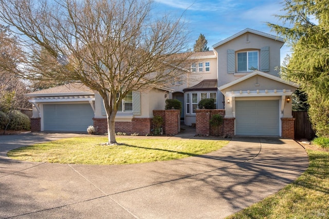 view of front of house featuring brick siding, stucco siding, concrete driveway, and a front yard