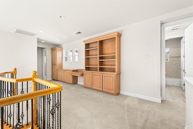 interior space with recessed lighting, visible vents, light colored carpet, and baseboards