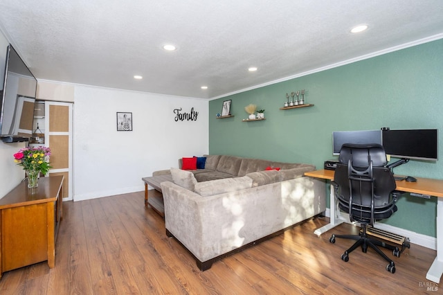 office area with hardwood / wood-style flooring and ornamental molding