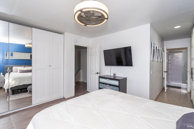 bedroom with dark hardwood / wood-style flooring