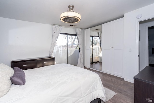 bedroom with hardwood / wood-style floors