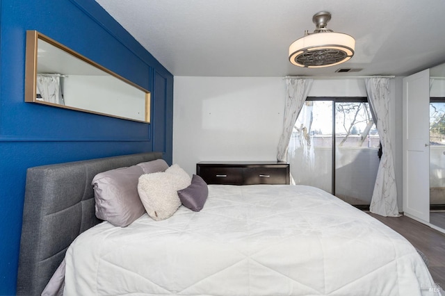 bedroom featuring dark hardwood / wood-style flooring