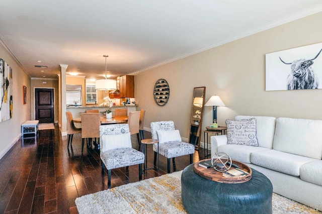 living room with hardwood / wood-style floors and crown molding