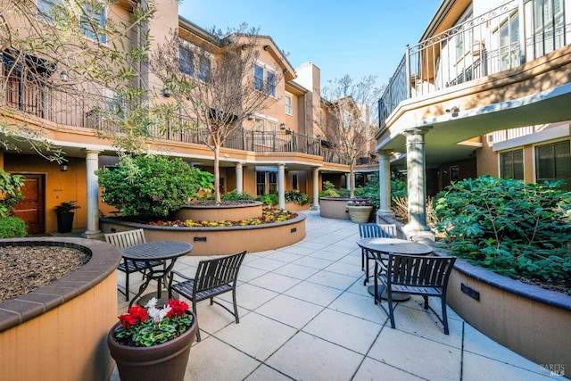 view of property's community with a patio