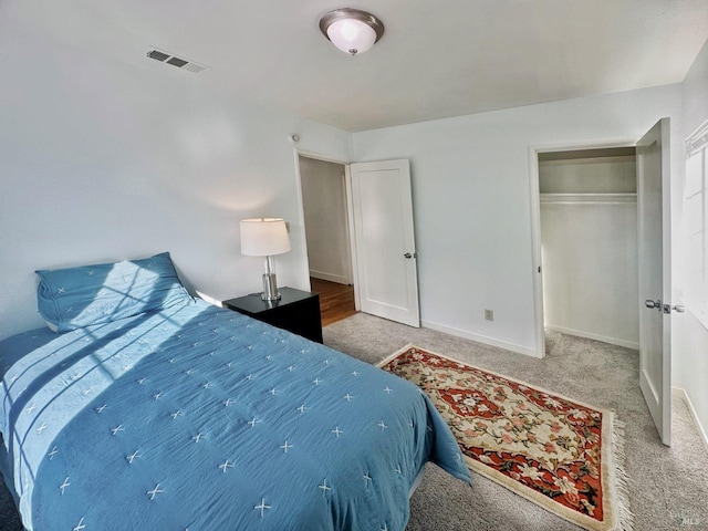 carpeted bedroom with a closet