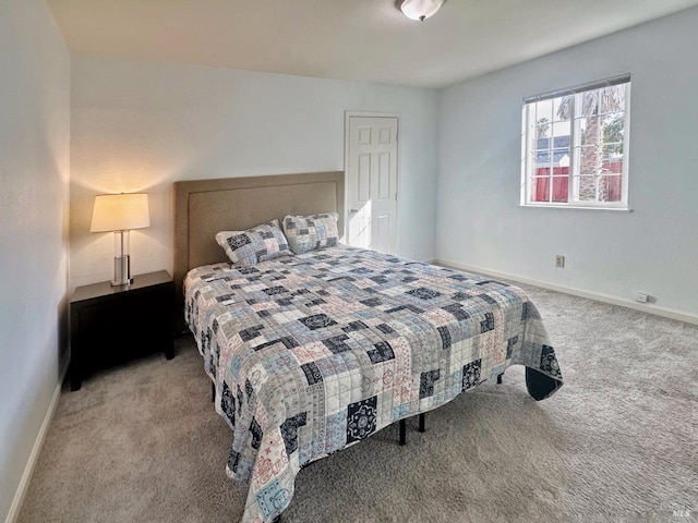 bedroom featuring light carpet