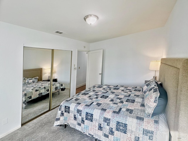 carpeted bedroom with a closet