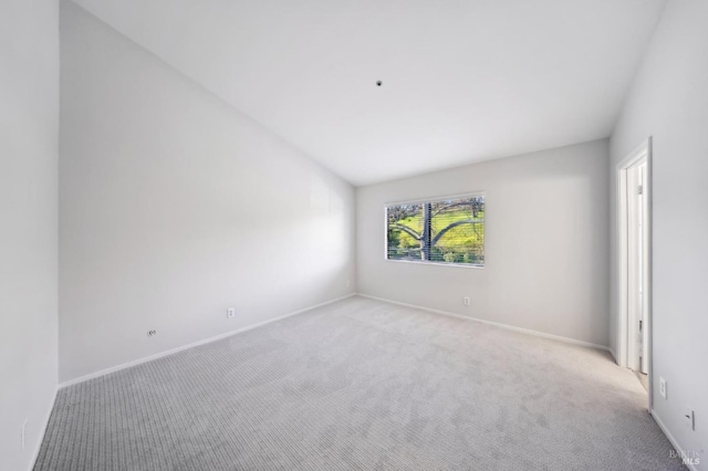 empty room featuring light colored carpet