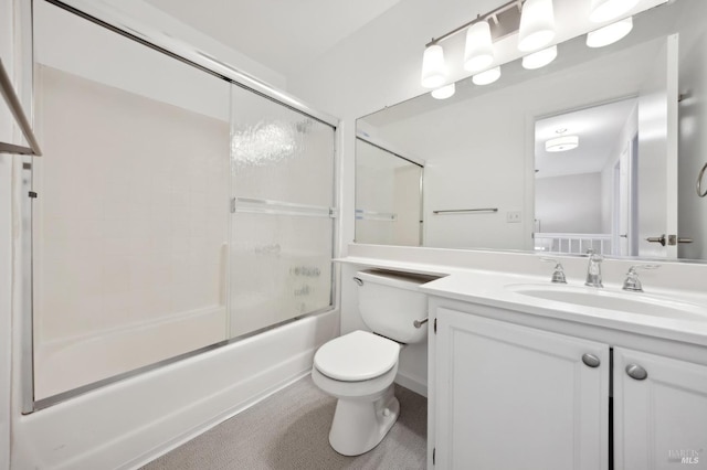 full bathroom featuring shower / bath combination with glass door, toilet, and vanity