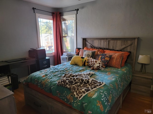 bedroom featuring hardwood / wood-style flooring