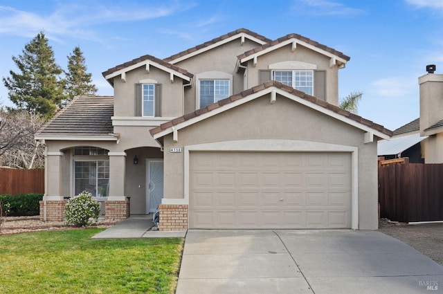 view of property with a garage and a front yard