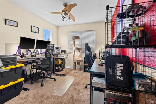 home office featuring carpet floors and ceiling fan