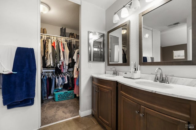 bathroom with vanity and tile patterned flooring