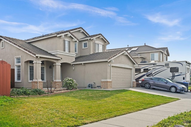 view of front facade featuring a garage and a front yard