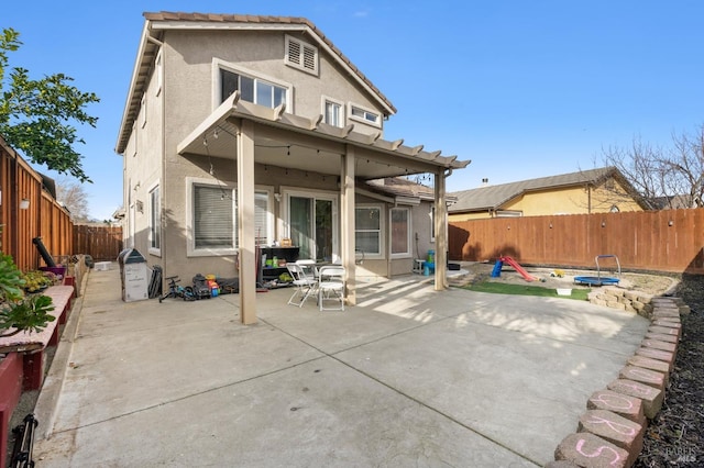 rear view of house featuring a patio area