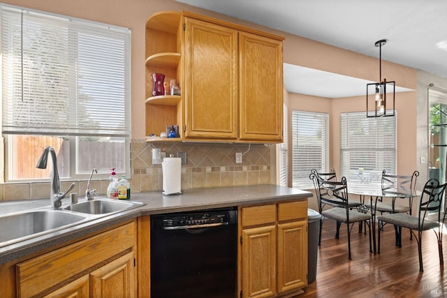 kitchen featuring hanging light fixtures, a wealth of natural light, and black dishwasher