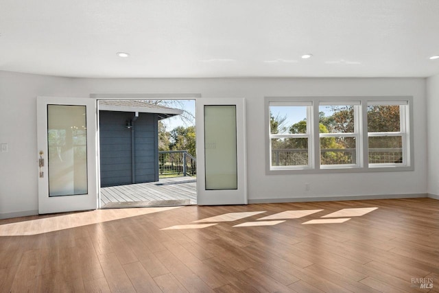 doorway to outside with french doors and hardwood / wood-style floors