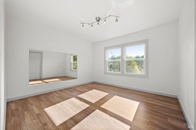 empty room featuring hardwood / wood-style flooring