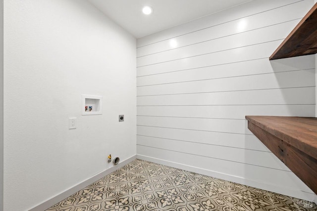 washroom featuring gas dryer hookup, light tile patterned floors, hookup for a washing machine, and hookup for an electric dryer