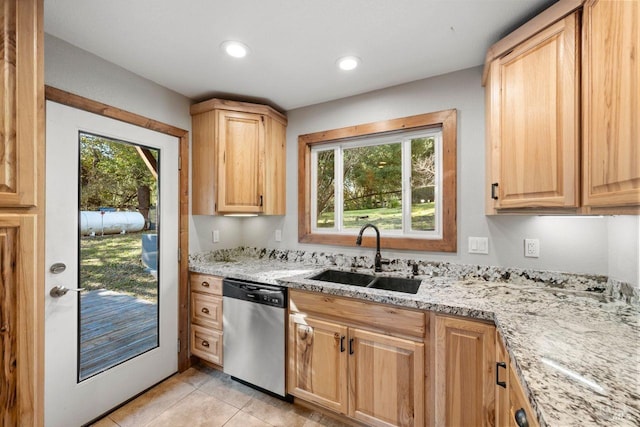 kitchen with sink, dishwasher, light stone counters, light brown cabinets, and light tile patterned floors