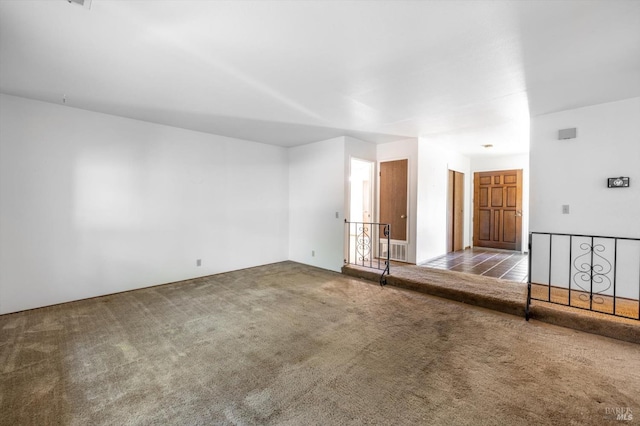 unfurnished room featuring carpet