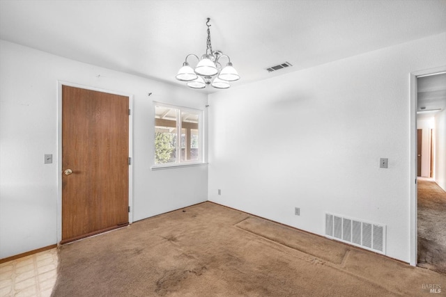 empty room featuring visible vents, a chandelier, and light colored carpet