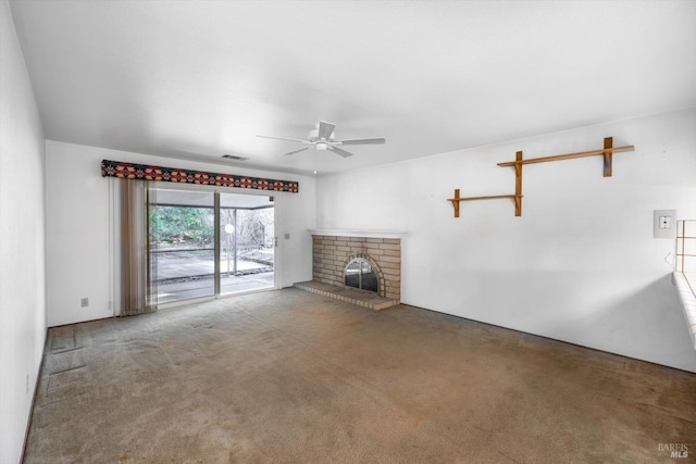 unfurnished living room featuring visible vents, a fireplace, a ceiling fan, and carpet flooring