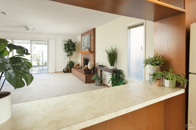 interior space with ceiling fan and a fireplace