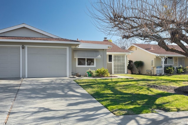 ranch-style home featuring a front lawn and a garage