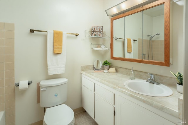 bathroom with toilet, vanity, tile patterned flooring, and walk in shower