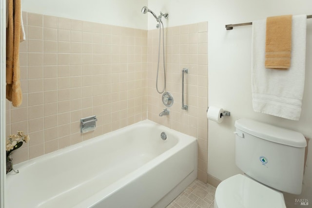 bathroom featuring toilet and tile patterned flooring