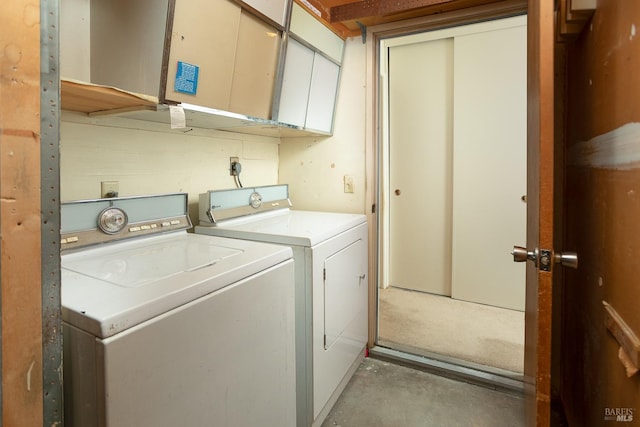 clothes washing area featuring washing machine and dryer