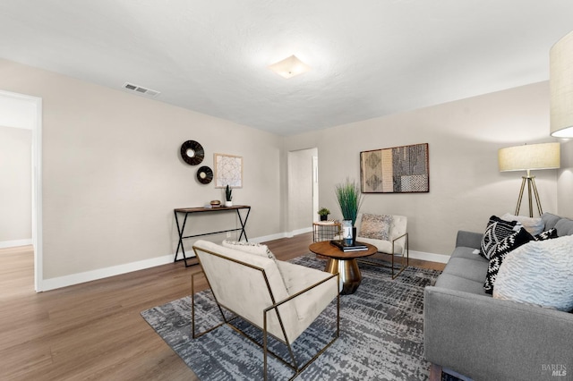 living room with dark hardwood / wood-style flooring