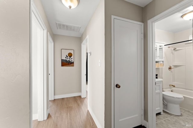 hallway featuring light hardwood / wood-style floors