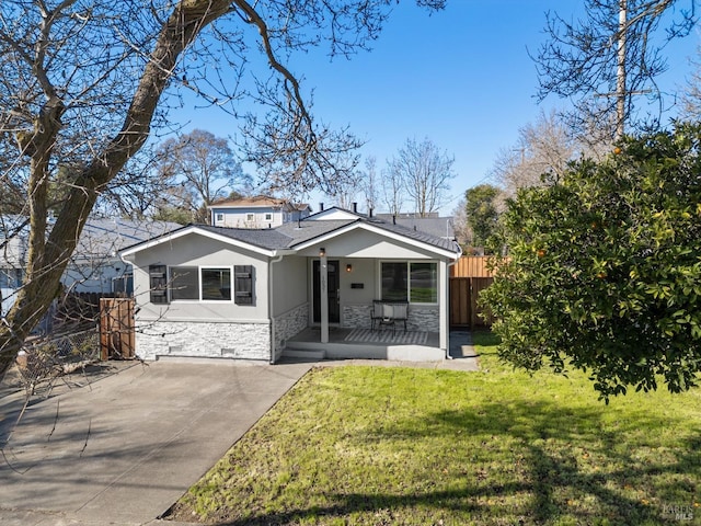 view of front of house with a porch and a front lawn