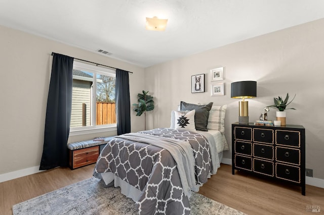 bedroom featuring light wood-type flooring