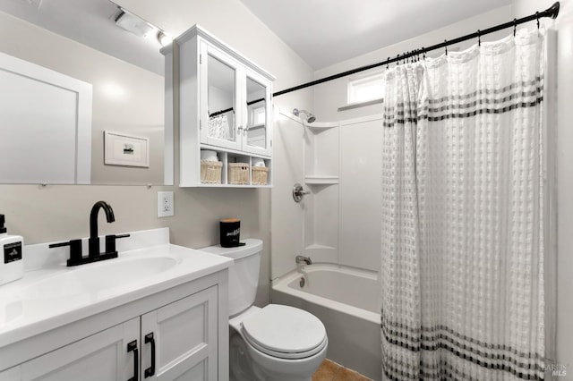 full bathroom with shower / bath combo with shower curtain, vanity, and toilet