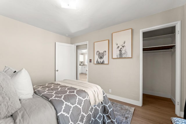 bedroom with a closet and hardwood / wood-style flooring