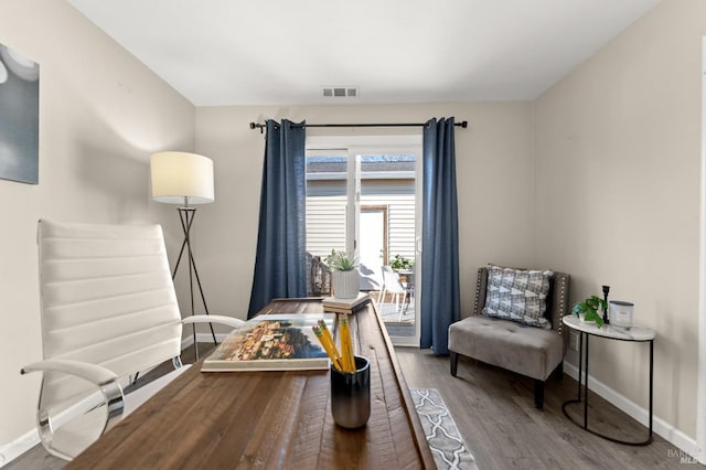 living area featuring hardwood / wood-style floors